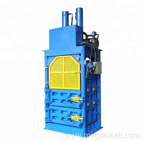 Hydraulic baling machine with pressure